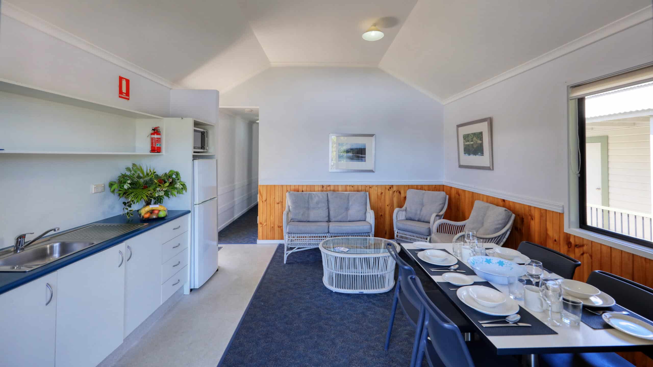 The kitchen and dining area in a Villa at Rainbow Beach Holiday Village