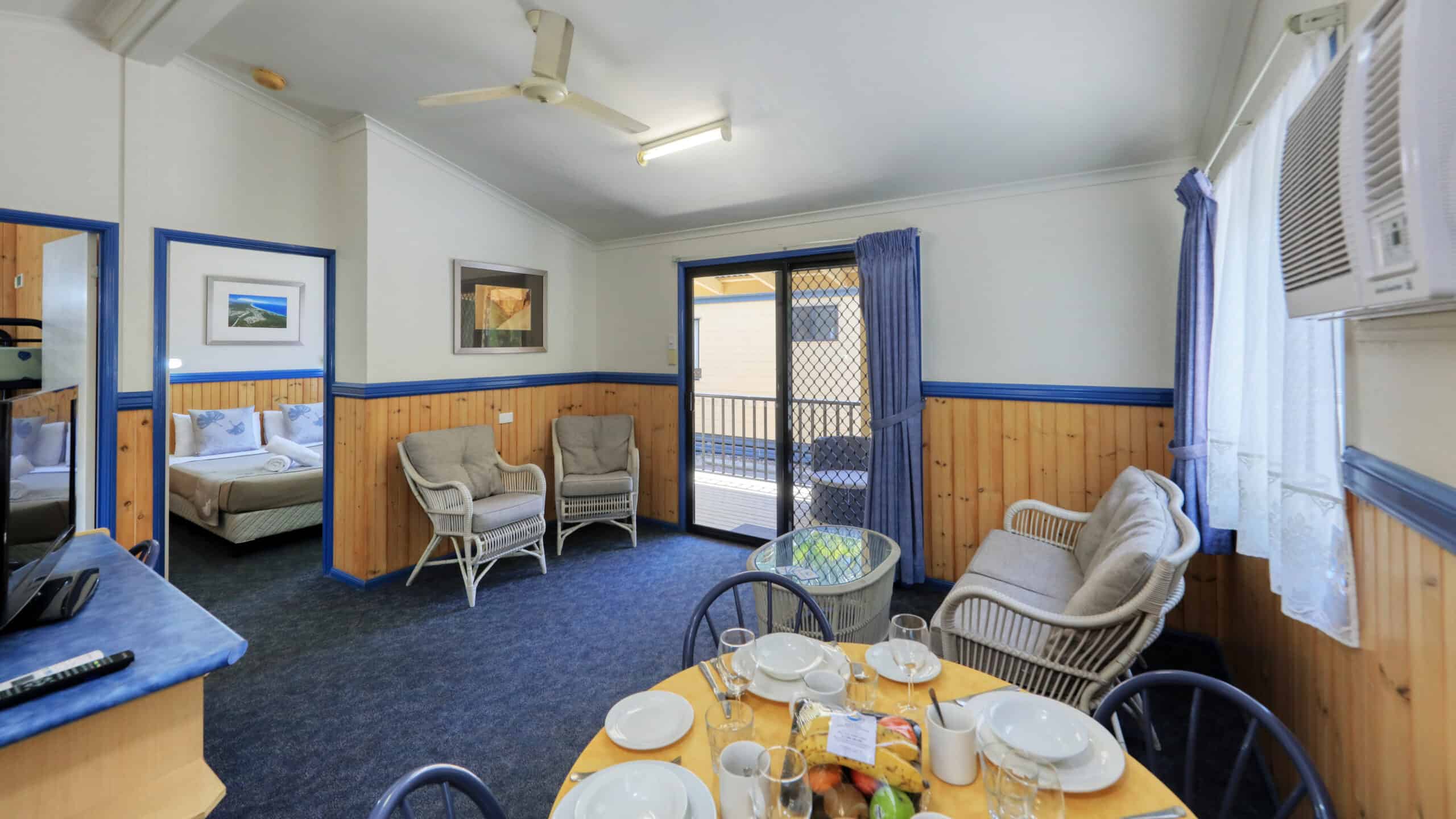 The living and dining area in a Chalet at Rainbow Beach Holiday Village