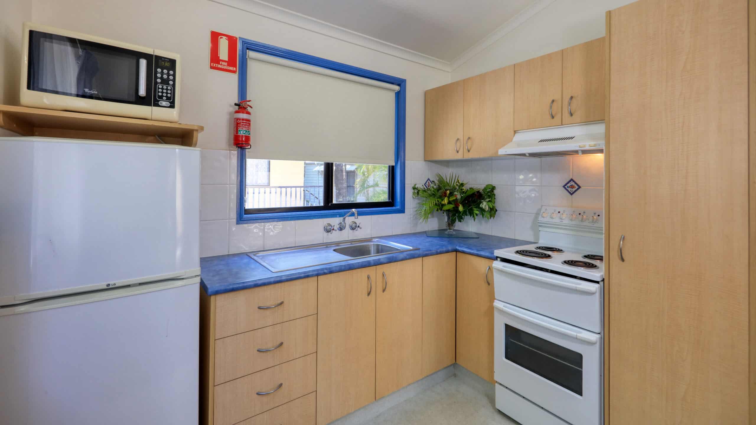 A kitchen in a Chalet at Rainbow Beach Holiday Village