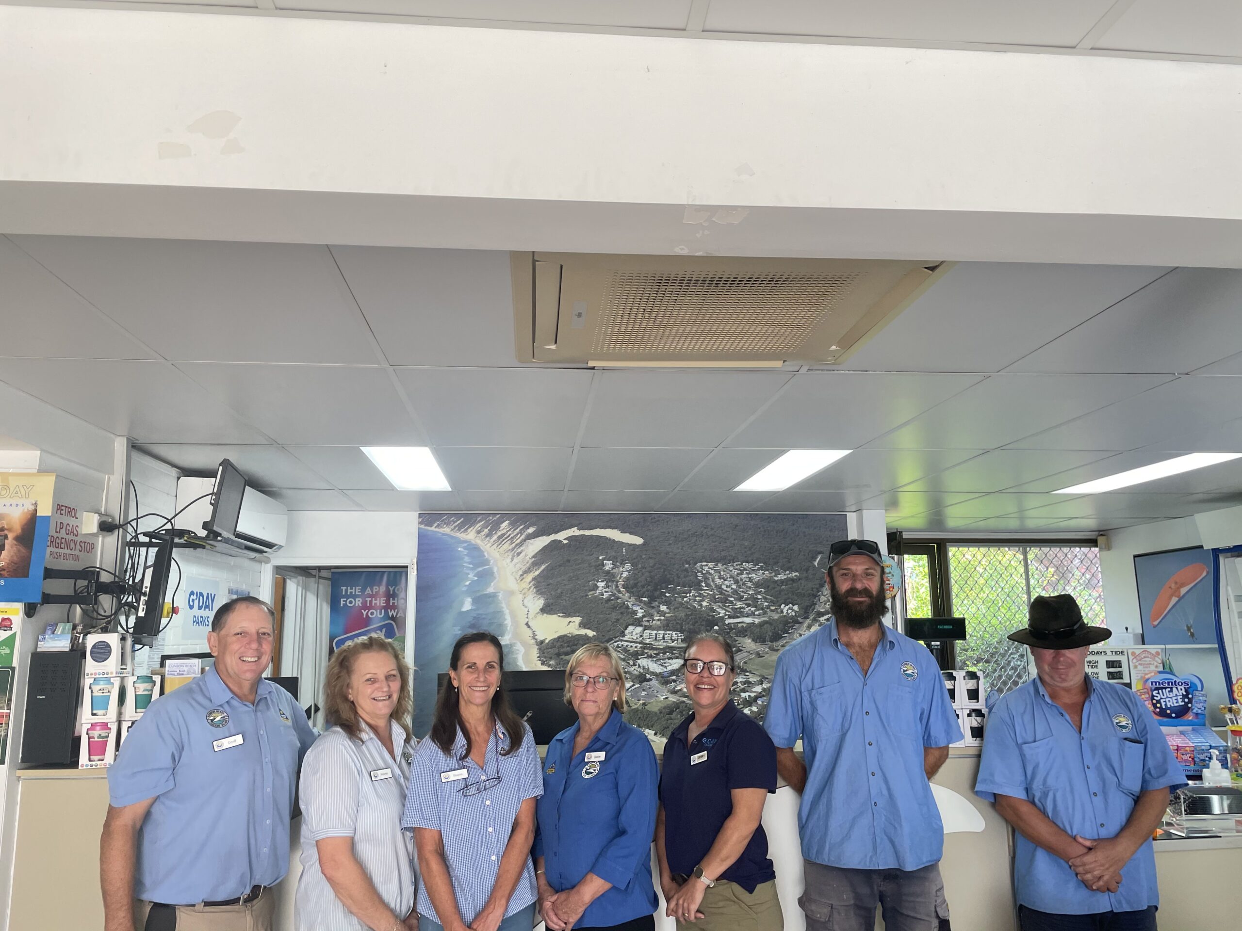 A team of employees at Rainbow Beach Holiday Village standing
