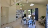 The dining and kitchen area in a Rainbow Beach Holiday Village Studio Villa