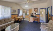 The living and dining area in a Chalet at Rainbow Beach Holiday Village