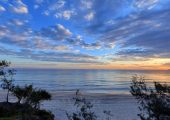A view of rainbow beach at sunset